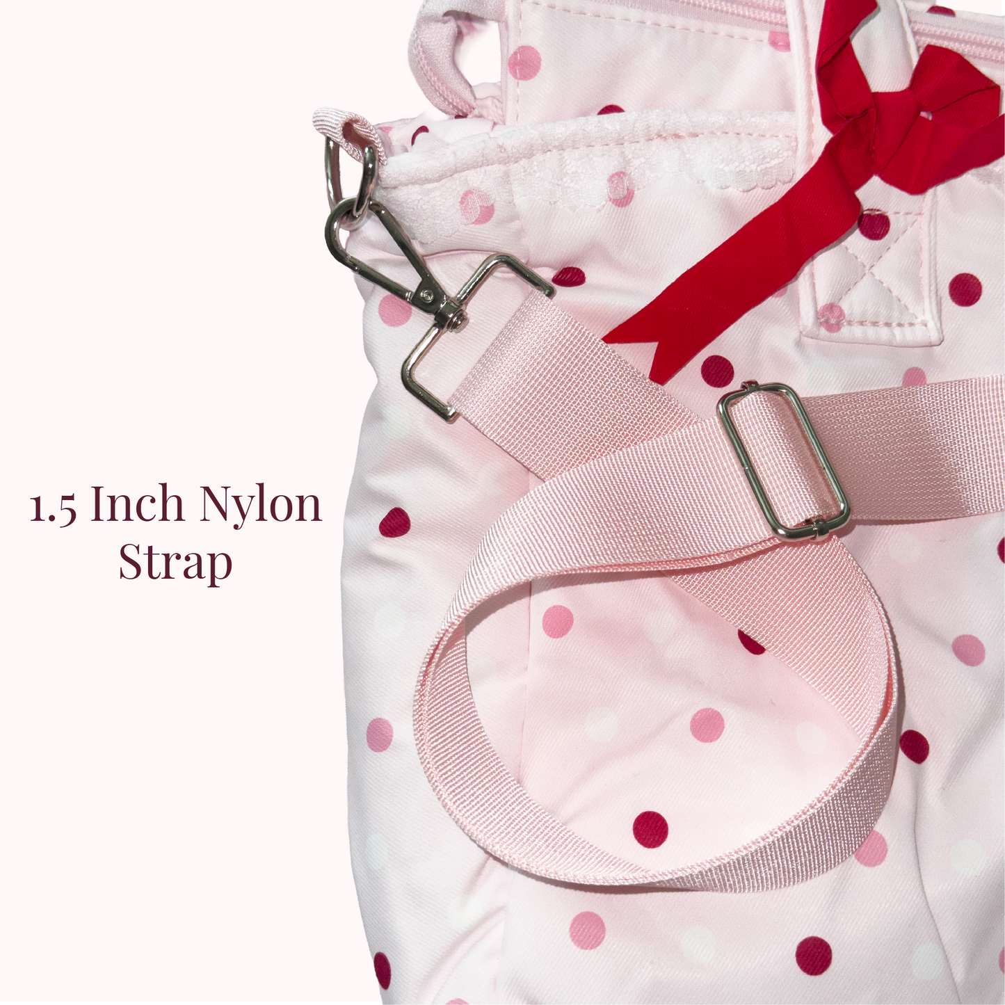 A close-up of a light pink nylon bag with dark pink polka dots, featuring a wide 1.5-inch nylon strap with silver metal hardware and a red ribbon bow, on a white background with text overlay.