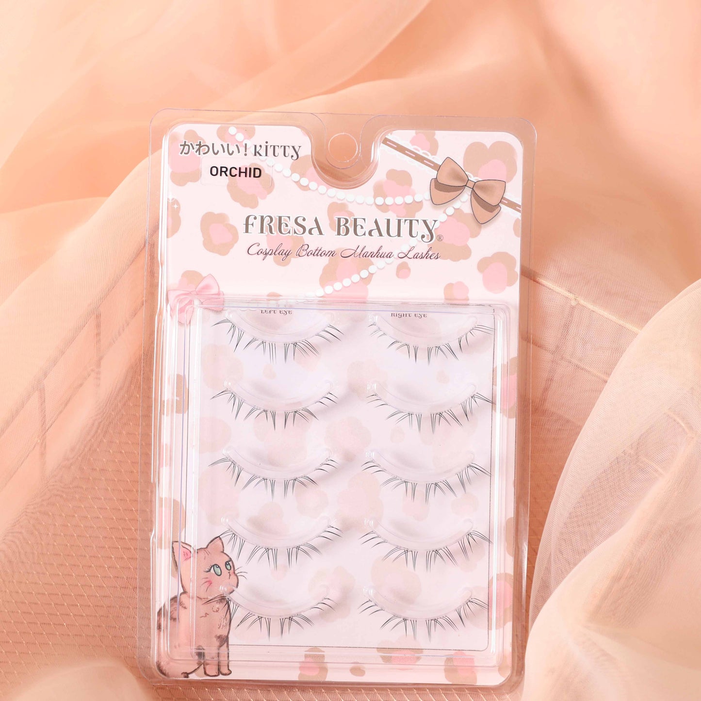 Fresa Beauty bottom false eyelashes packaging with kitty design on a soft peach background