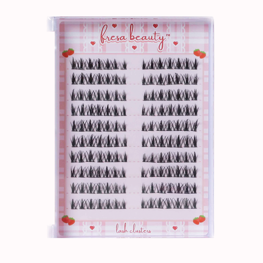 Fresa Beauty lash clusters packaging with gingham background and heart designs.