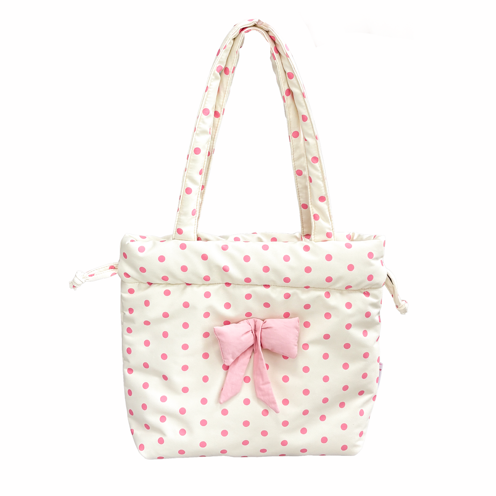 A cream yellow-colored padded tote bag with pink polka dots, featuring a matching pink fabric bow on the front and dual shoulder straps, set against a plain white background.