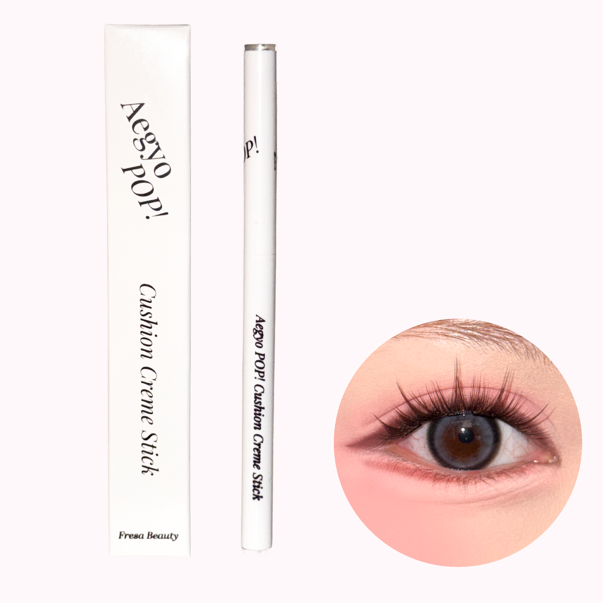 A white cosmetic pencil and its matching box for an Aegyo Pop! Cushion Creme Stick by Fresa Beauty, shown next to a circular insert demonstrating the makeup applied to an eye.